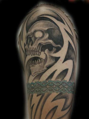 Tattoos - Anthony Lawton - skull negative tribal