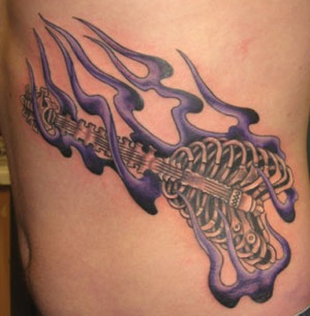 guitar tattoos. Tattoos flaming guitar