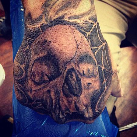 Big Gus - realistic black and gray skull, with spider web tattoo, Big Gus Art Junkies Tattoo