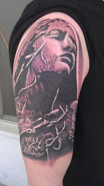 Scott Grosjean - black and grey realistic angle statue portrait tattoo
