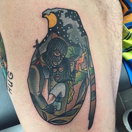 Gary Dunn - Traditional color grenade with couple inside tattoo Gary Dunn Art Junkies Tattoo