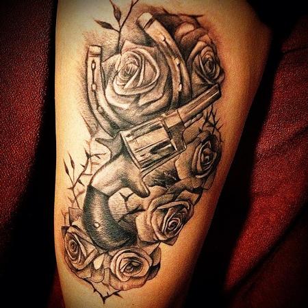 Big Gus - black and gray roses with horse shoe and gun tattoo
