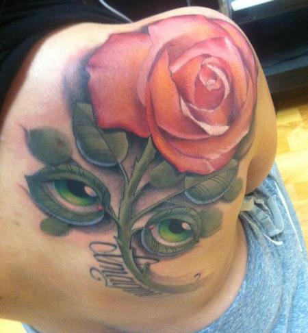 Tim Mcevoy - colored realistic rose with eyes as leaves tattoo