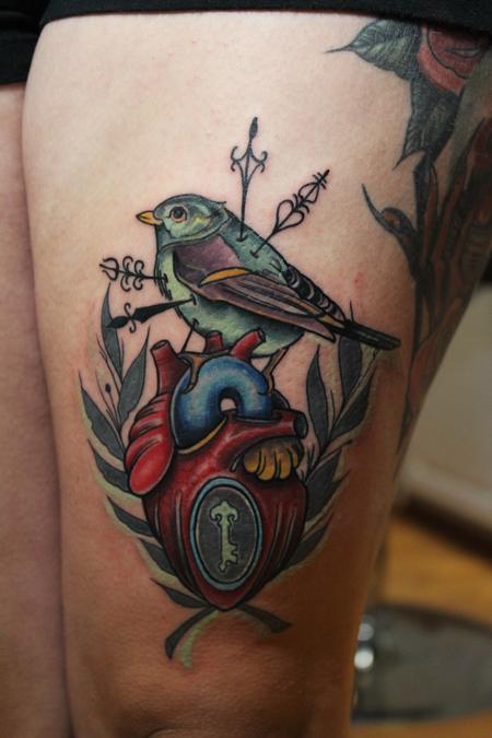 Mike Riedl - Traditional color bird with heart tattoo. Mike Riedl Art Junkies Tattoo