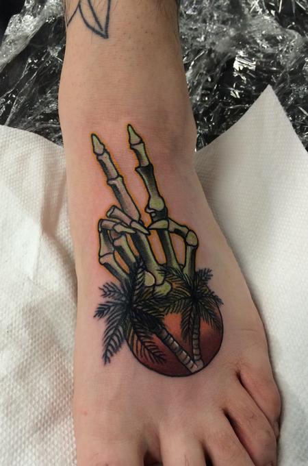 Mike Riedl - Traditional color skeleton hand with palm tree and sun tattoo, Mike Riedl Art Junkies Tattoo.