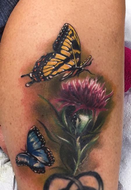 Ryan Mullins - Realistic color butterflies with thistle flower. Ryan Mullins Art Junkies Tattoo