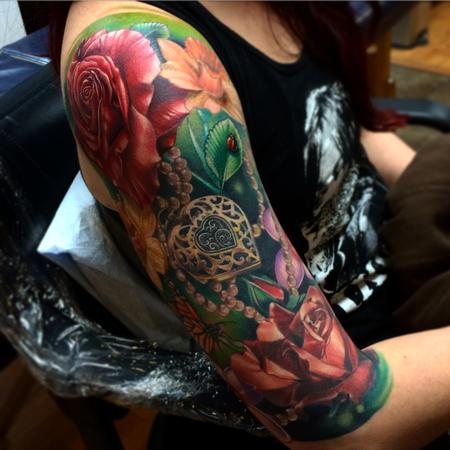 Brent Olson - Realistic roses with locket and lady bug color tattoo, Brent Olson Art Junkies Tattoo