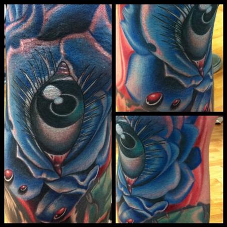 Aric Taylor The Dark Horse - realistic colored eye in a rose tattoo