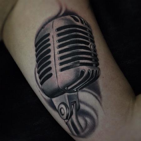 Aric Taylor The Dark Horse - black and gray microphone tattoo 