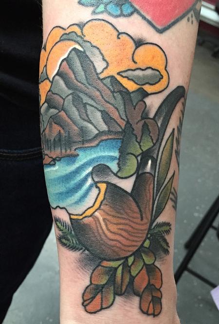 Gary Dunn - Traditional color pipe with water and mountains tattoo. Gary Dunn Art Junkies Tattoo 