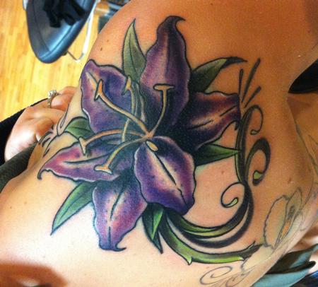 Mike Riedl - beautiful and colorful traditional flower tattoo