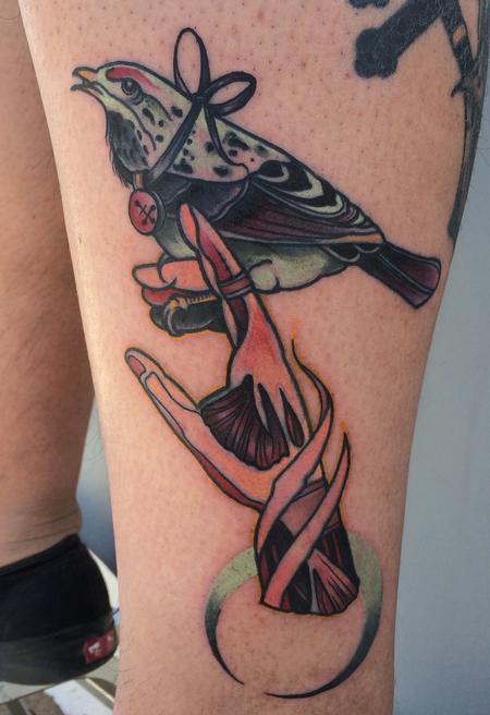 Mike Riedl - traditional color bird on hand tattoo. Art Junkies Tattoos Mike Riedl