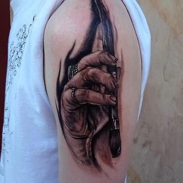 Big Gus - Black and grey hand with paint brush tattoo