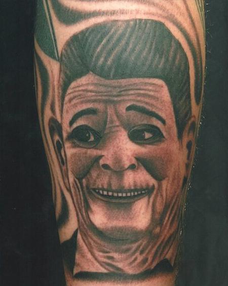 Scott Grosjean - black and grey realistic Ronald Reagan mask tattoo