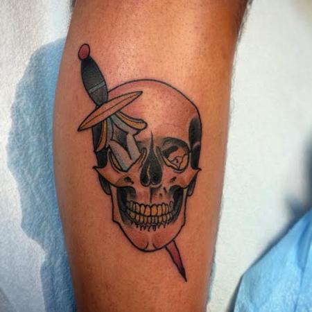 Mike Riedl - Traditional skull with knife tattoo. Mike Riedl Art Junkies Tattoo