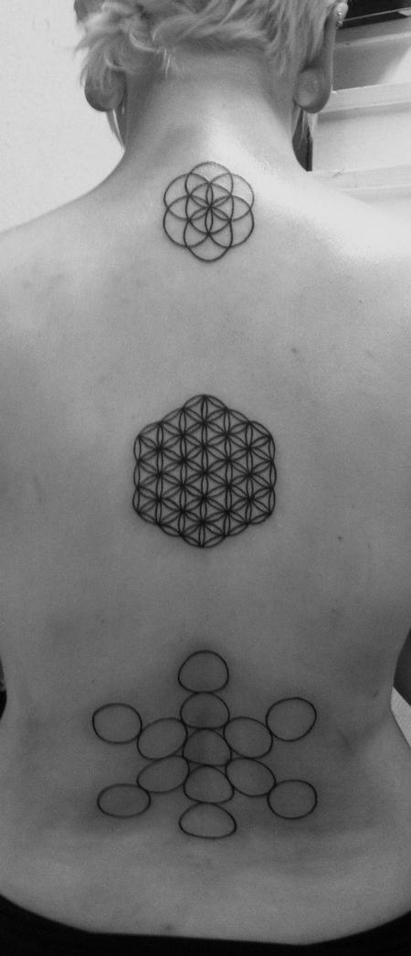 This is a tattoo I did of some of my favorite symbols the flower of life