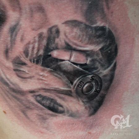 Capone - Bite the Bullet Smoking Rib Cage Tattoo (Closeup)