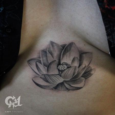 Capone - Lotus Flower Sternum Tattoo