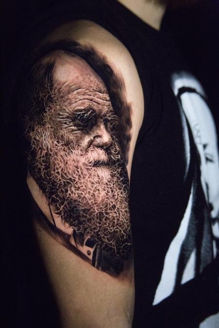 Carlos Ortiz - black and grey Darwin portrait tattoo