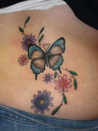 This butterfly and flowers design was made to coverup a tiny butterfly 