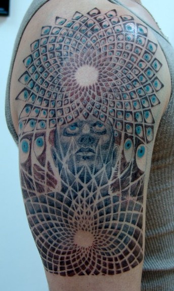 Black and Grey tattoo of an Alex Grey painting with some light blue color 