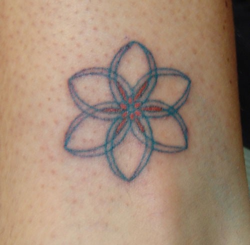 flower of life tattoo in teal and orange