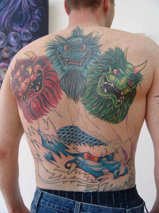 Progress on the Oni Mask Back piece tattoo First session of color on the Progress on the Oni Mask Back piece tattoo First session of color on the