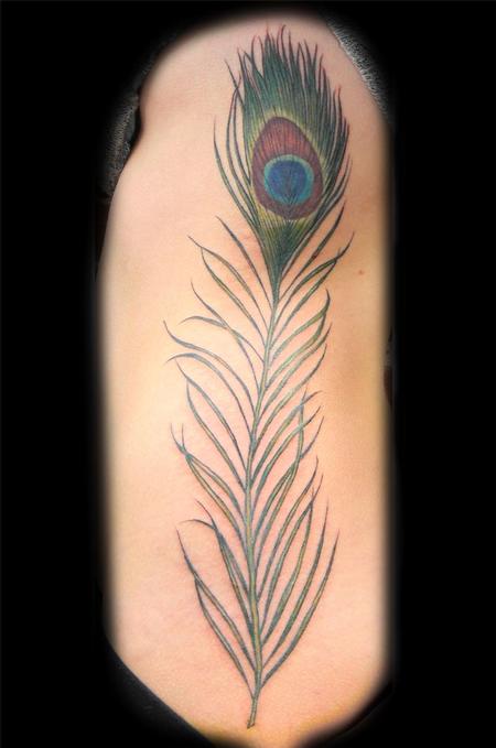 peacock feather on a woman's side Keyword Galleries Color Tattoos