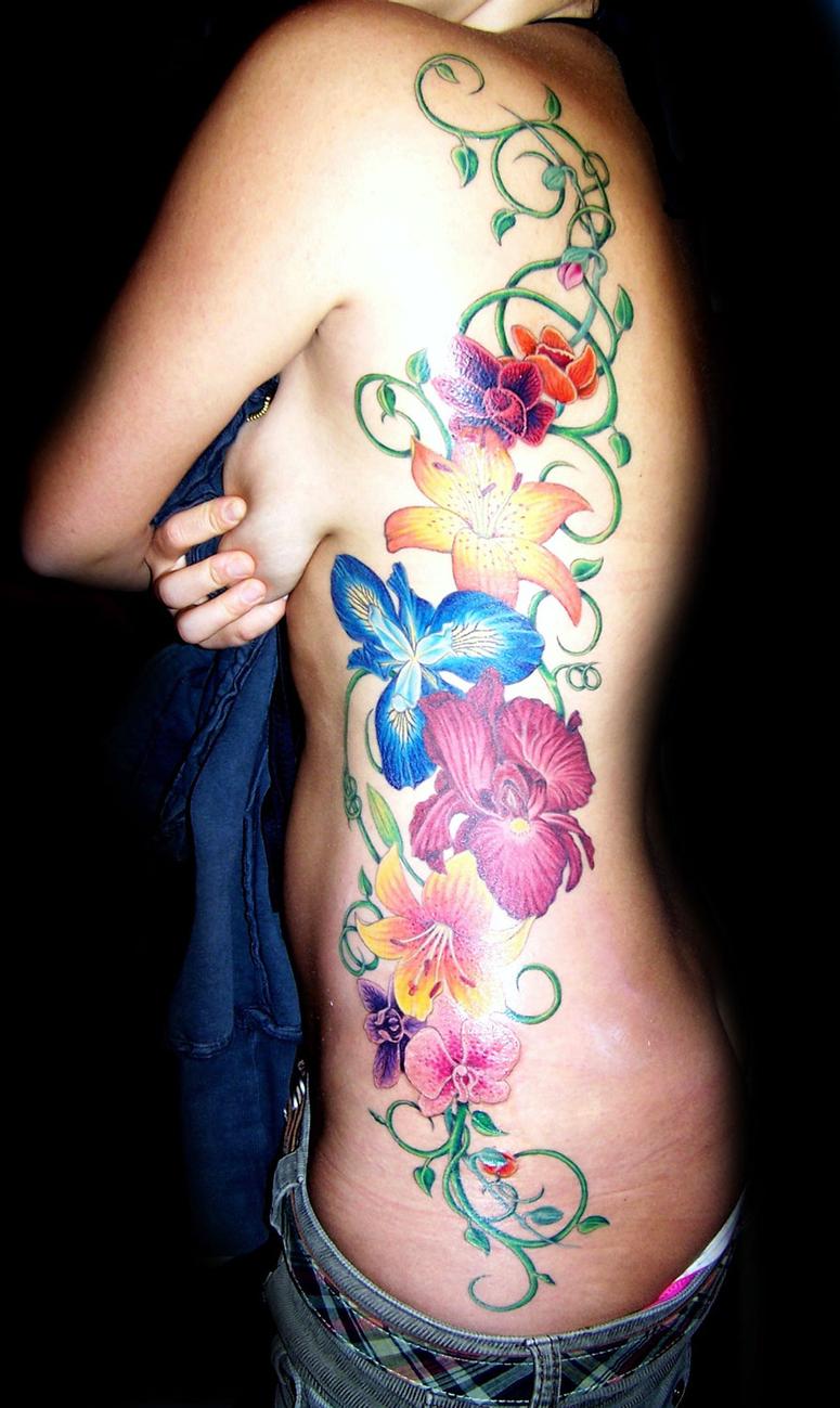 Angela Leaf - realistic color flower vine side tattoo