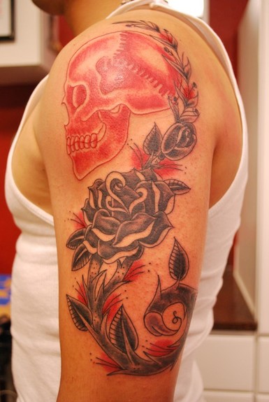 Traditional Skull And Rose Tattoo