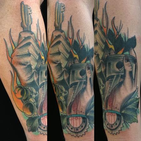 Gary Dunn - traditional color hand with harley davidson parts tattoo,Gary Dunn Art Junkies Tattoo