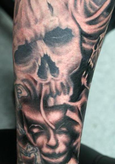 Black Skull and creepy Face filler Tattoo