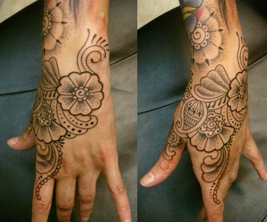 Cory Ferguson flower hand tattoo