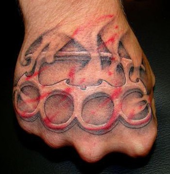 Dmitry Pastukhov Brass Knuckle Hand Tattoo