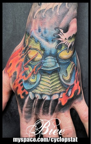 Looking for unique Tattoos Hand Mask Tattoo 
