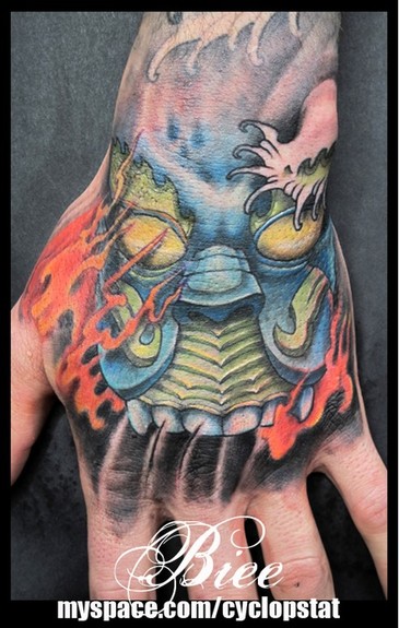 Looking for unique Tattoos Hand Mask Tattoo