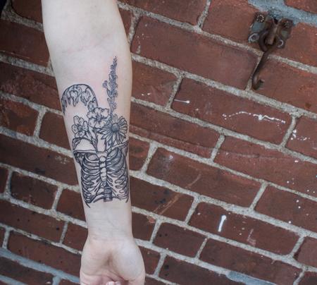 Tattoos - Black illustrative rib cage with wild flowers tattoo on forearm - 129200