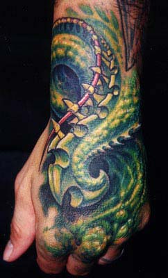 Guy Aitchison - Coil Tattoo on Hand