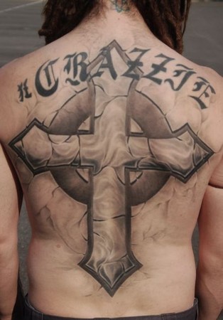 stone cross tattoo. Stone looking cross back piece
