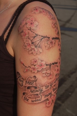 Jen drove out from Wisconsin to get this cherry blossoms tattoo with a quote