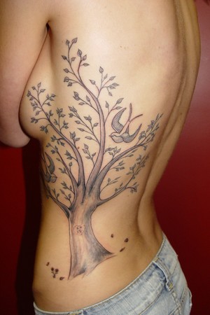 Tattoos Carter Moore Tree and Bird Rib Tattoo click to view large image