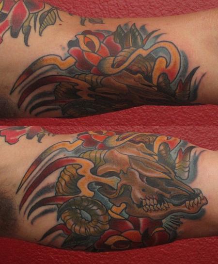 Robert Hendrickson - Ram Skull with roses tattoo 