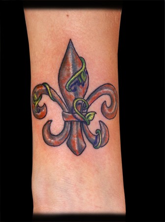 A rusty fleur de lis on her