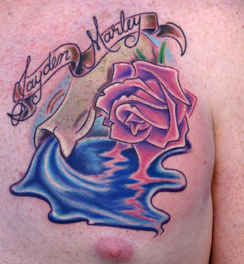 This is a tattoo for his daughter showing her name and a vessel spilling This is a tattoo for his daughter showing her name and a vessel spilling