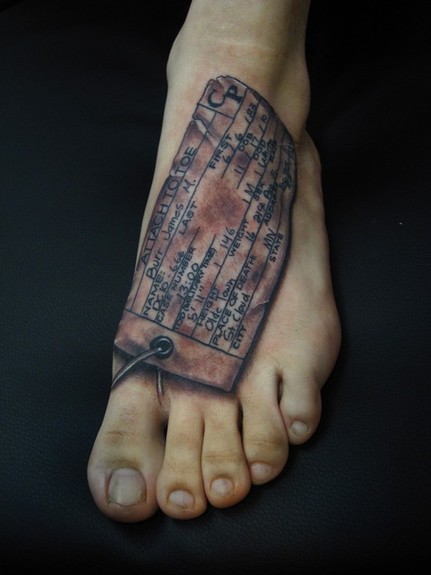 Jon von Glahn Toe tag black and grey foot tattoo