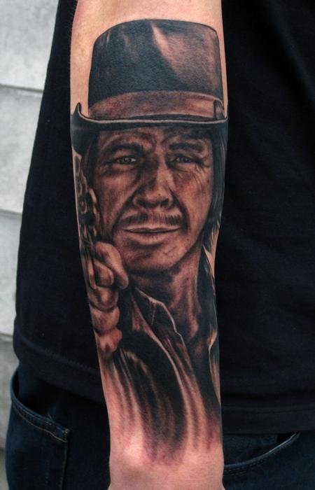 Charles Bronson black and grey portrait arm tattoo