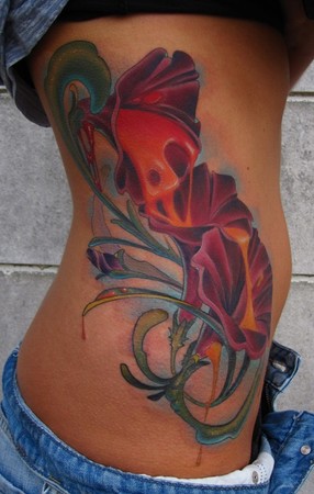flower tattoos for girls on side. tattoo on girls ribs.