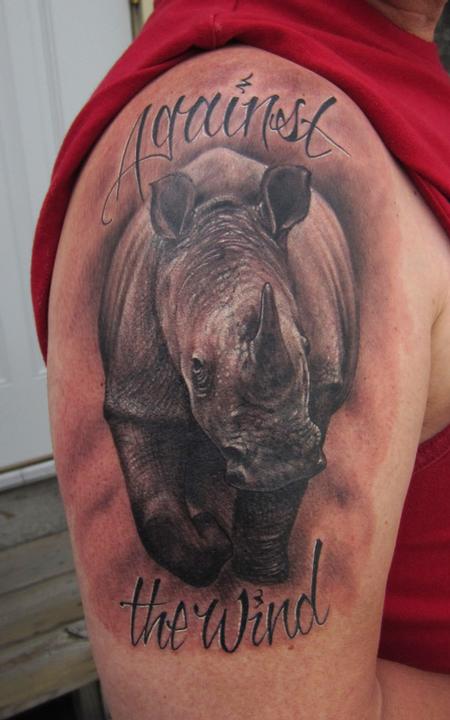 Rhino replication wildlife realism black and grey arm tattoo