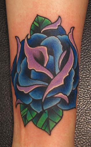 Jon von Glahn Traditionalish blue rose arm tattoo