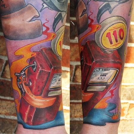 vintage gas pump color arm tattoo with flames